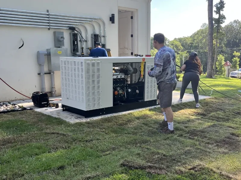 Generator installer making the electrical connections to the home.