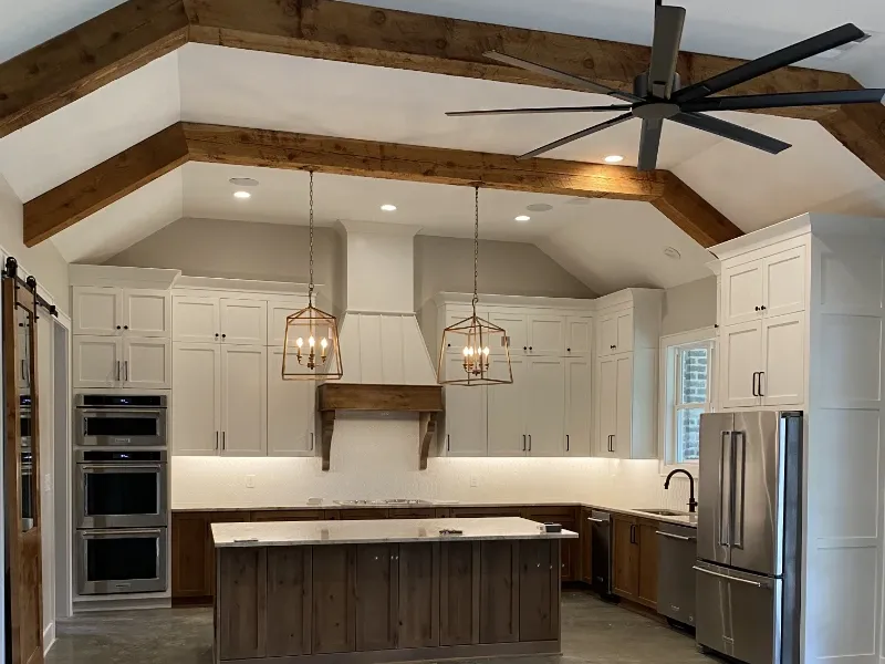 A custom kitchen with copper and wood accents.